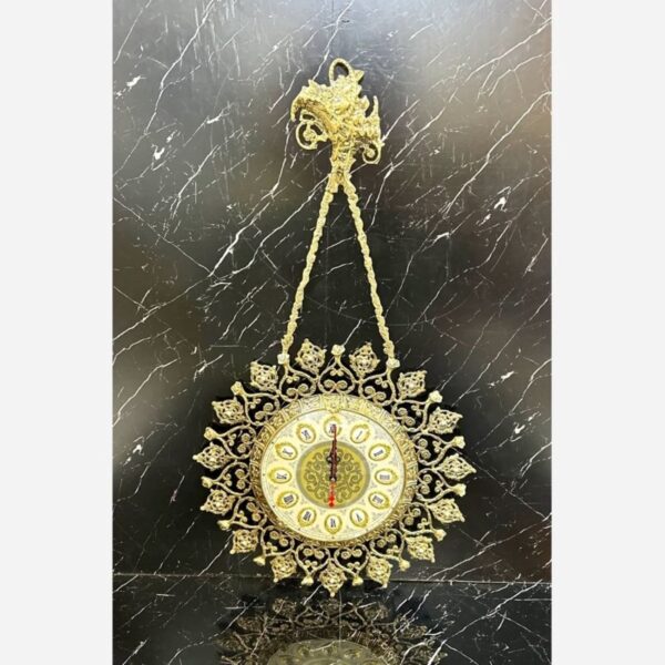 Charming Brass Wall Clock with Decorative Floral Accents and Hanging Detail