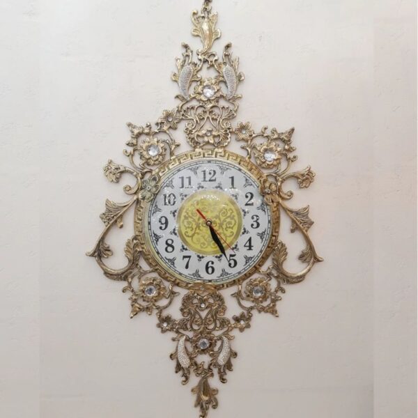 Luxurious Brass Wall Clock Featuring a Delicate Floral Hanging Accent